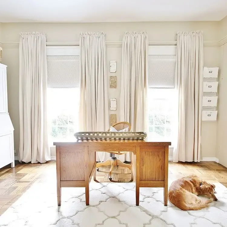 Motorized shades and drapery in a bright home office