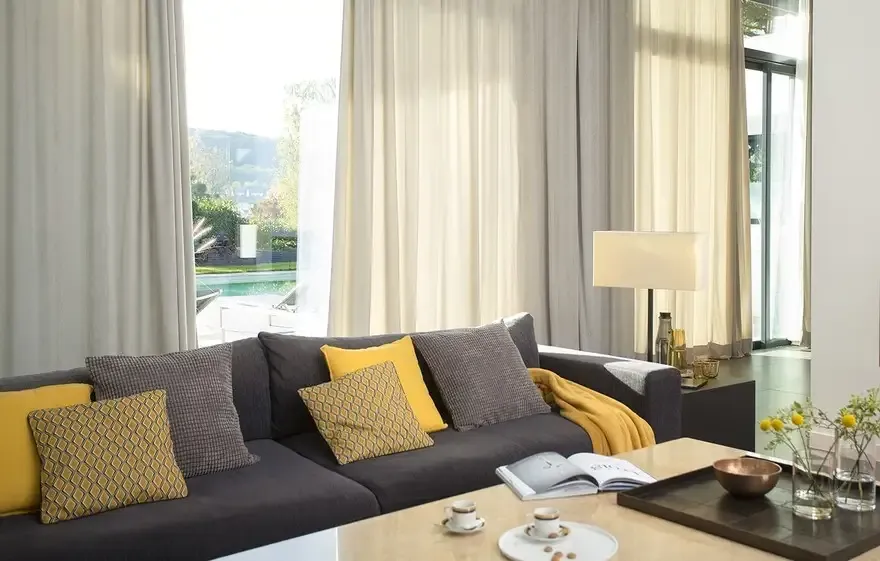 Living room with floor-to-ceiling motorized drapery